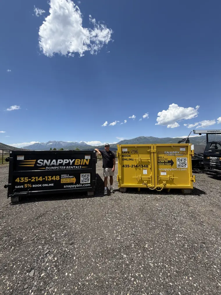 Snappy Bin roll-off dumpster rentals in Park City, Utah — black and yellow 15-yard bins with the Wasatch mountains behind