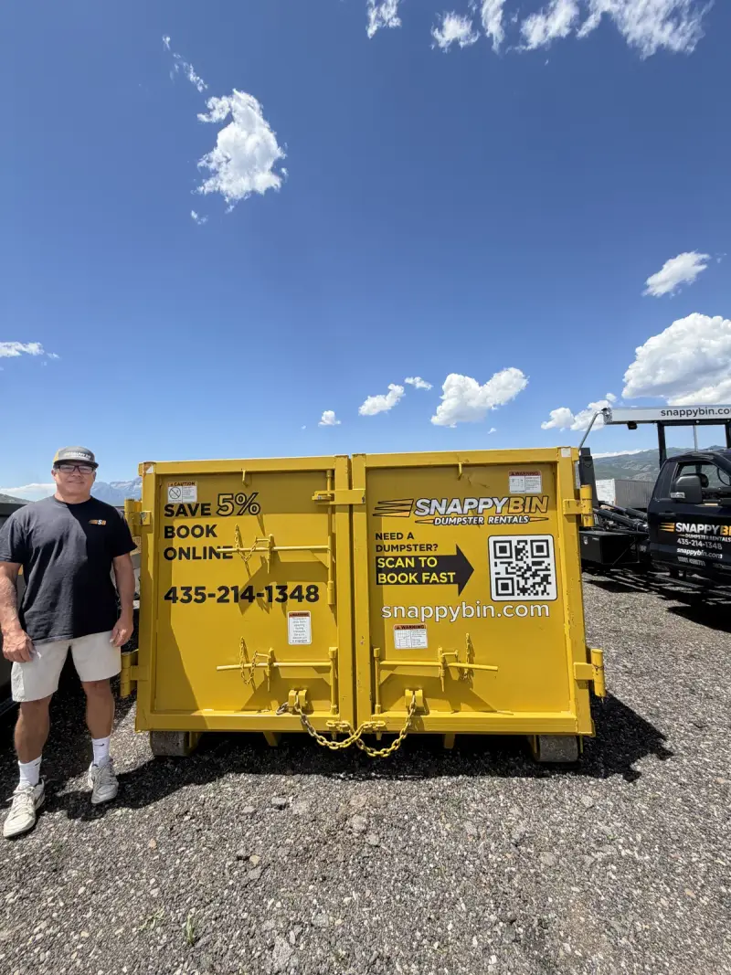 Snappy Bin hooklift truck and yellow roll-off dumpster in Park City, Utah